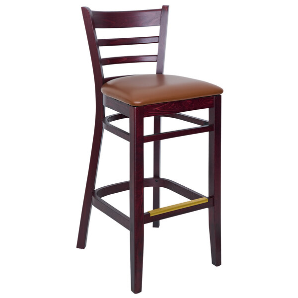 A BFM Seating Berkeley dark mahogany wooden barstool with a light brown vinyl seat.