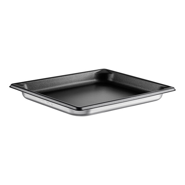 A silver Vollrath stainless steel steam table pan with a black surface.