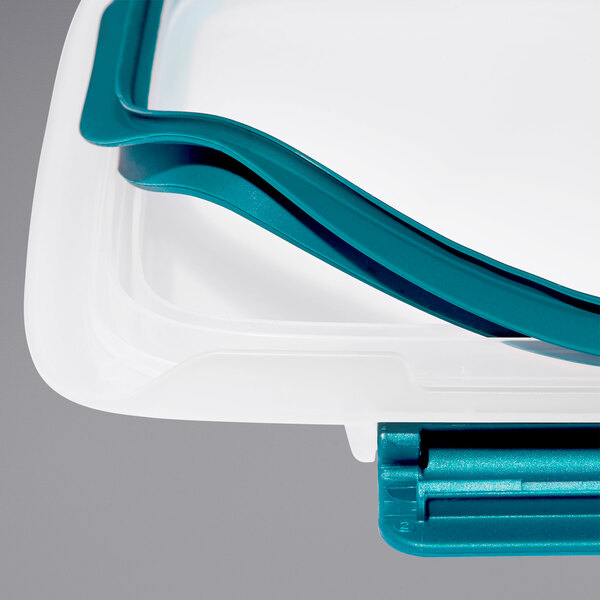 A white OXO rectangular polypropylene container with a blue lid.