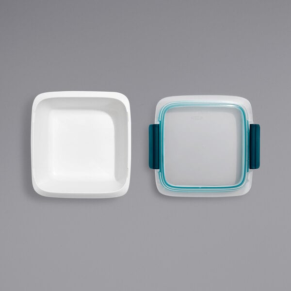 Two OXO Prep & Go rectangular containers with snap-on lids.