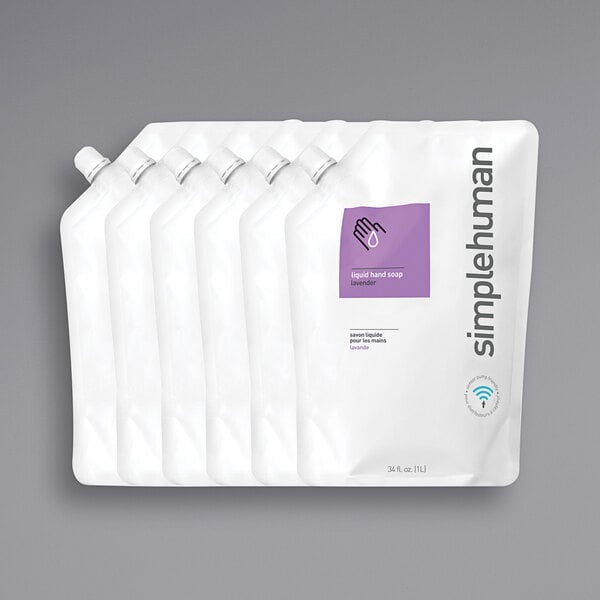 A group of simplehuman lavender scented liquid hand soap refill pouches with purple labels.