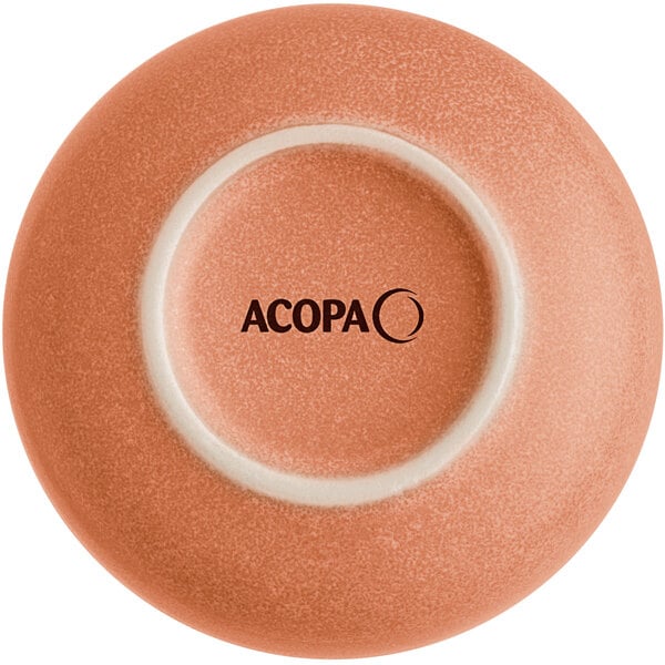 A close-up of an Acopa Terra Cotta ramekin with a white circle on the bottom.