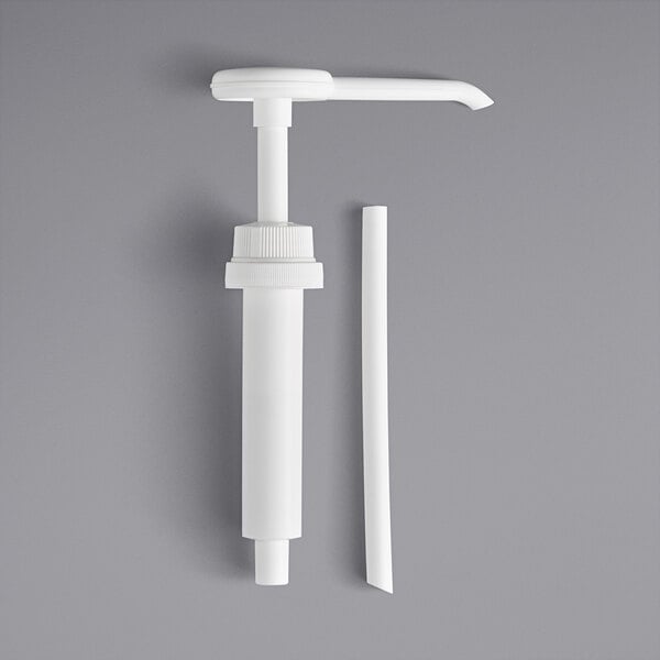 A white plastic condiment pump with a white plastic straw.