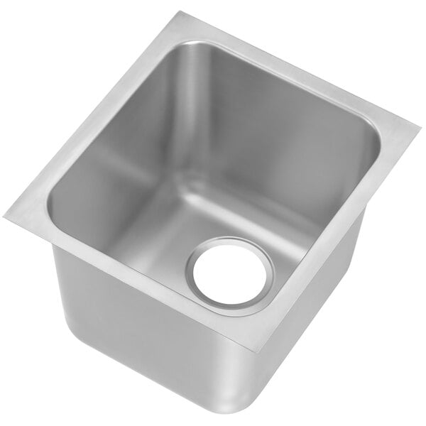 A Vollrath stainless steel sink bowl with a drain hole.