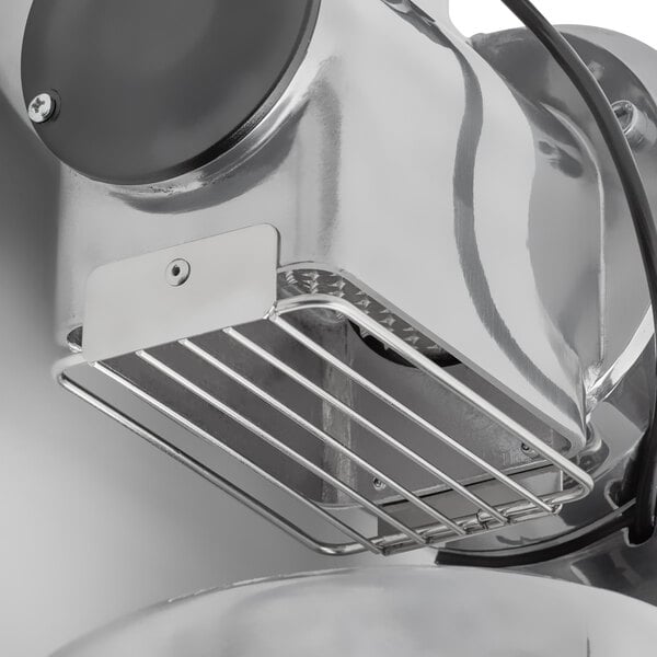 An Estella electric hard cheese grater with a metal basket.