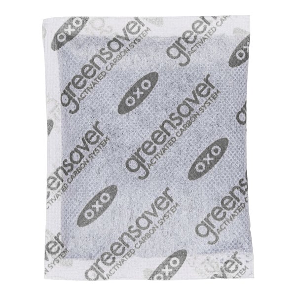 A small rectangular packet labeled 'greensaver' and 'OXO,' containing an activated carbon system.