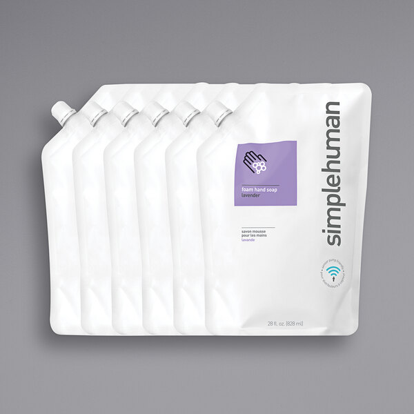 A group of white plastic bags with a purple and white label that reads "simplehuman Lavender Scented Foam Liquid Hand Soap"