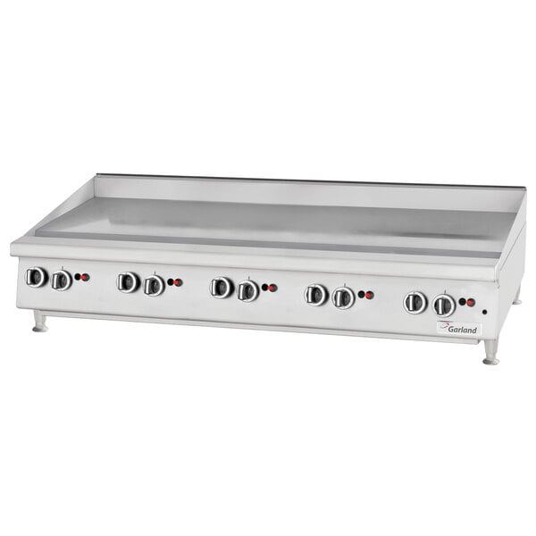 A Garland countertop gas griddle on a counter.