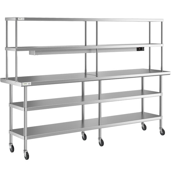 A stainless steel Regency expeditor table with double overshelf and two undershelves on wheels.