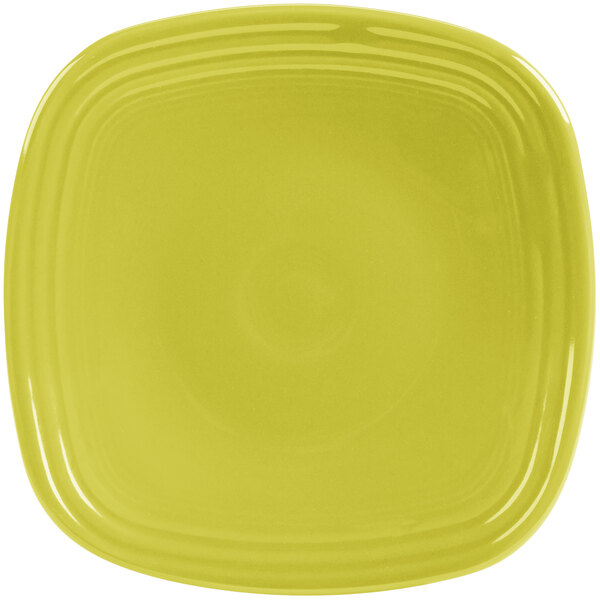 A Fiesta Lemongrass square china salad plate with a yellow rim.