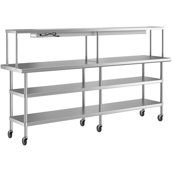 A stainless steel Regency work table with shelves on wheels.