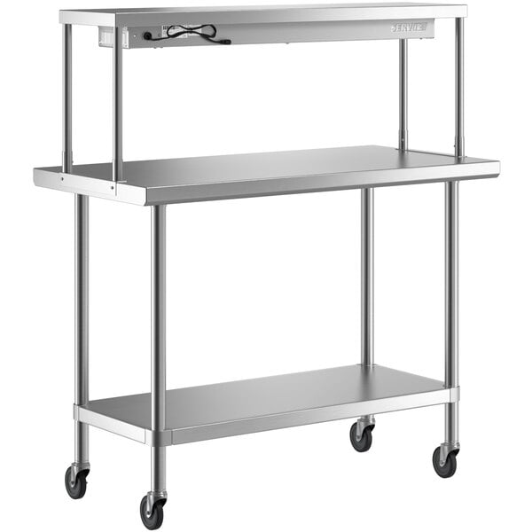 A silver stainless steel Regency expeditor table with shelves on wheels.