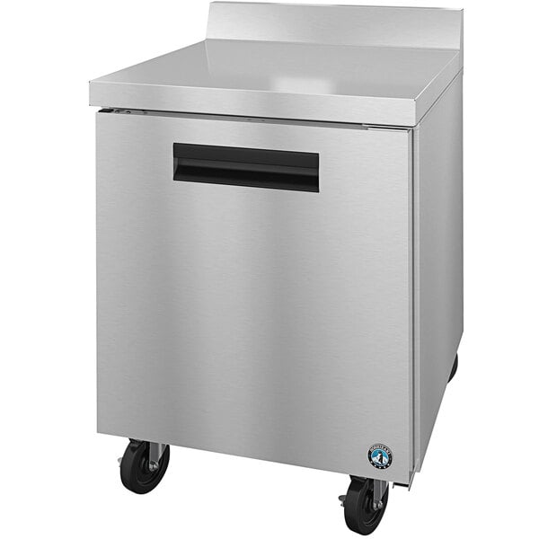 A stainless steel Hoshizaki worktop freezer with black wheels.