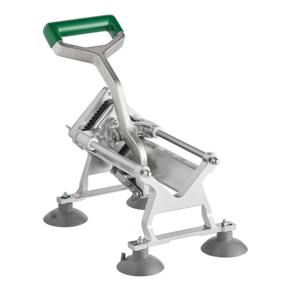 A heavy-duty vegetable dicer with a green handle and four suction cup feet for stability.