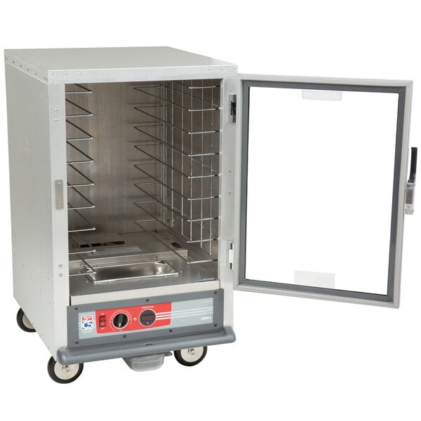 A Metro half-size holding cabinet with a clear door open.