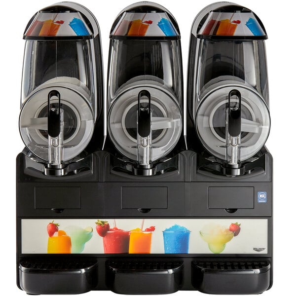 A Vollrath frozen beverage machine with three different slushy drinks in cups.