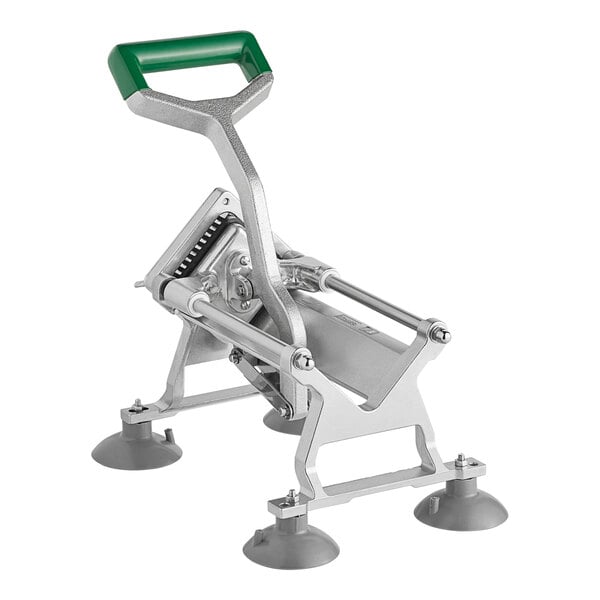 A heavy-duty vegetable dicer with a green handle and suction cup feet for stability.