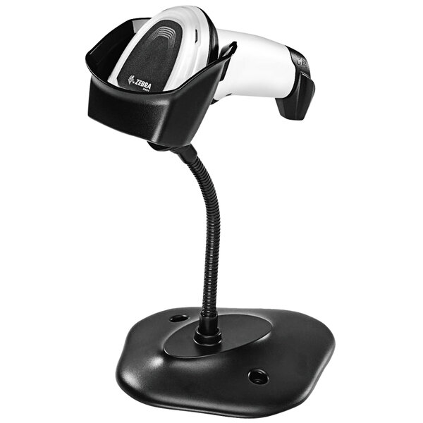 A white Zebra barcode scanner on a stand.