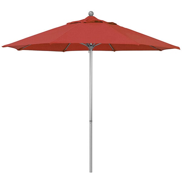 A red California Umbrella on a gray pole.