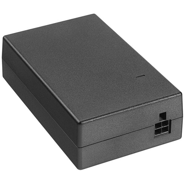 A black rectangular Zebra power supply brick with a square plug.
