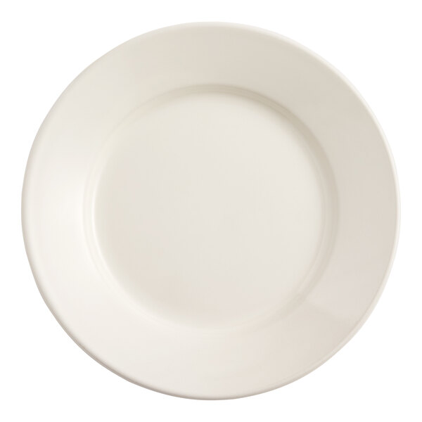 An Acopa ivory stoneware plate with a wide, round edge.