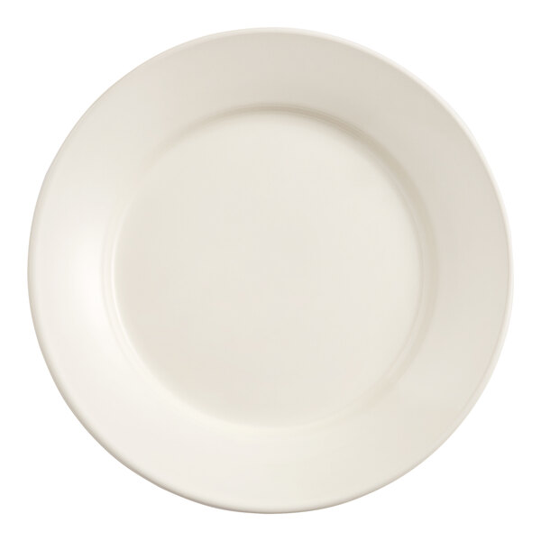 An Acopa ivory stoneware plate with a wide rim.