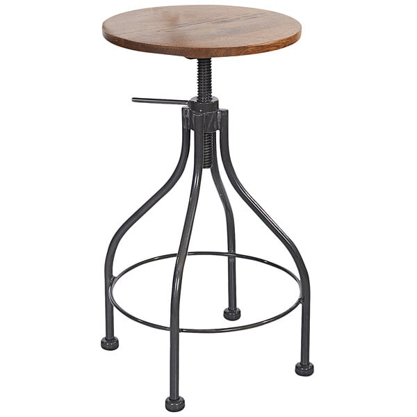 A clear coated steel backless barstool with a wooden top and metal ring.