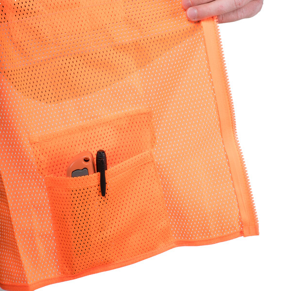 An orange mesh pocket with a pen and pen holder on a Cordova Orange high visibility safety vest.