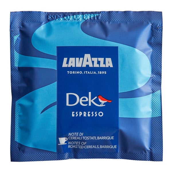 A blue packet labeled 'Lavazza Dek Espresso' with branding and text indicating notes of roasted cereals and barrique.