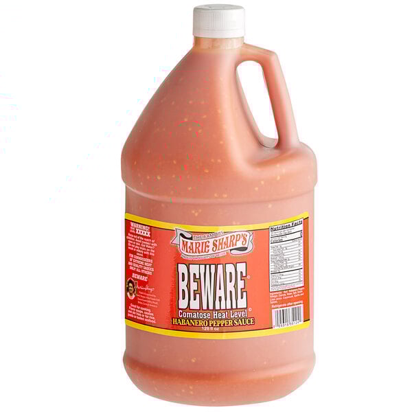 A plastic jug of Marie Sharp's Beware Comatose Habanero Hot Sauce.