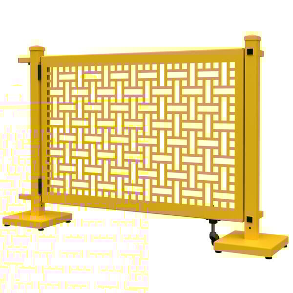 A bright yellow metal fence with a square weave pattern.