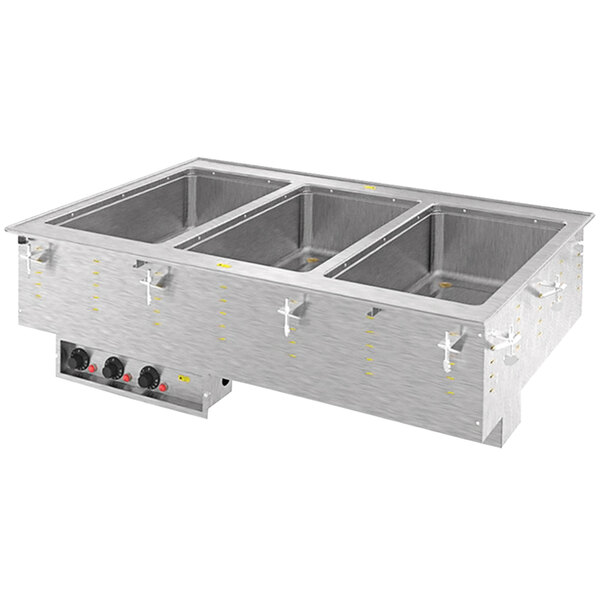 A Vollrath drop-in hot food well with three compartments on a counter.