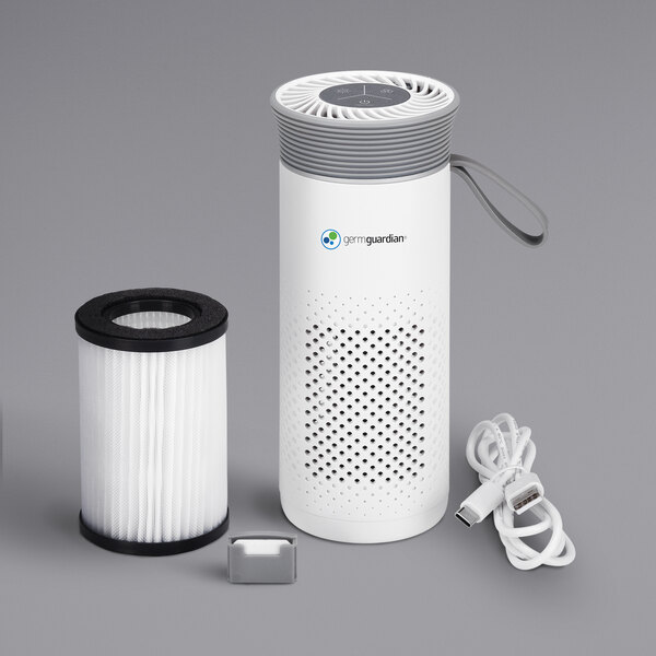A white air purifier with gray accents and a black filter cartridge.