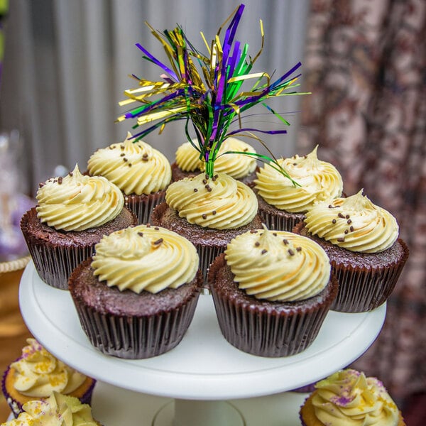 A group of 1 7/8" x 1 5/16" Glassine Baking/Candy Cups filled with cupcakes on a white plate.