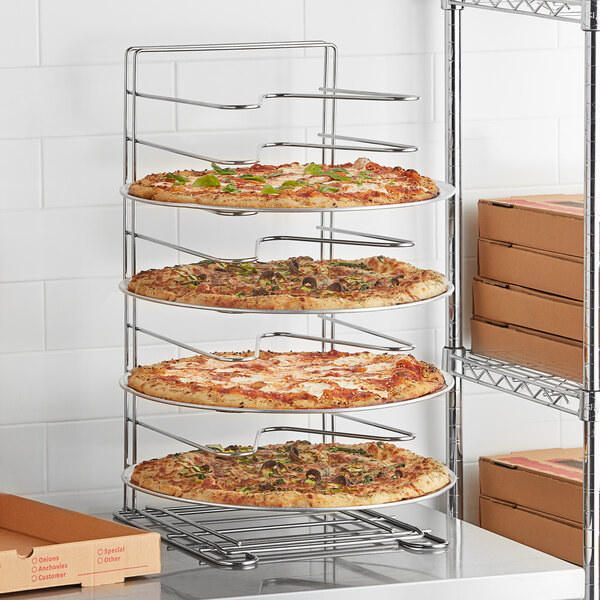 A GI Metal pizza rack with pizzas on it.