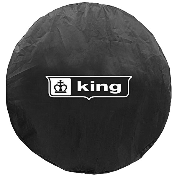 A King Electric round white fan cover with a black logo.