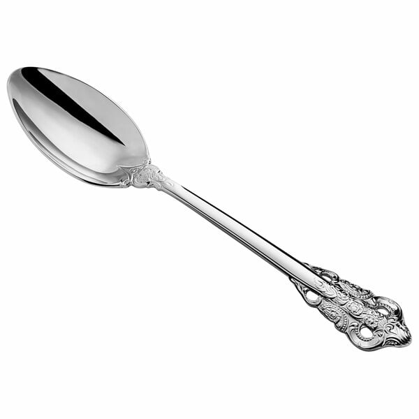 An Acopa Ophelia stainless steel serving spoon with an ornate handle.