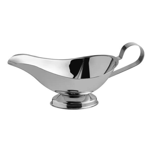 A stainless steel gravy boat with a handle and a pedestal base.