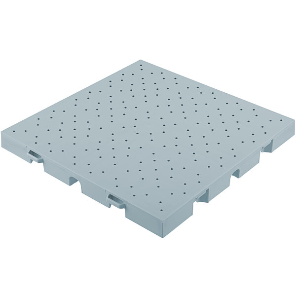 A light blue plastic floor tile with holes.