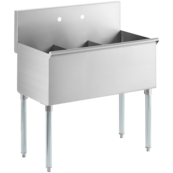 A Regency stainless steel utility sink with three compartments.