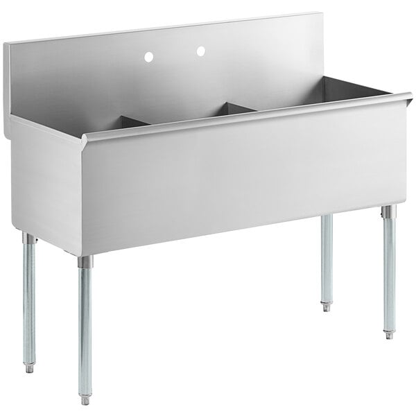 A Regency stainless steel utility sink with three compartments.