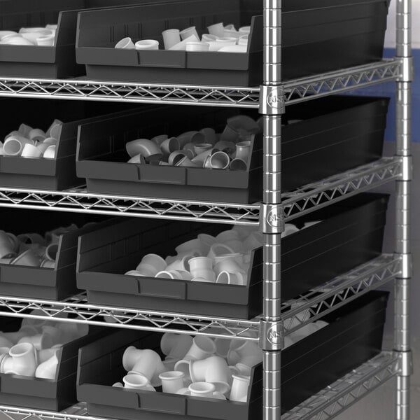 A metal shelving unit with black Regency shelf bins.