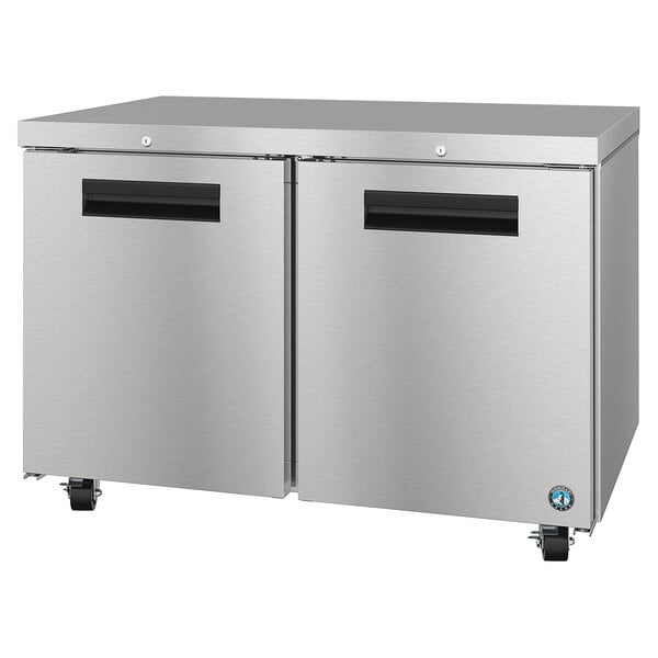 A stainless steel Hoshizaki undercounter refrigerator with black handles.