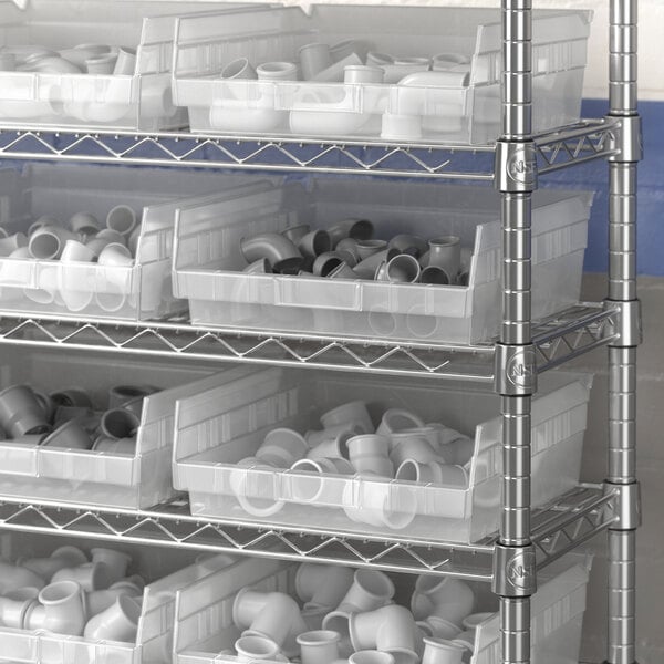 Regency clear plastic shelf bins on a metal shelving unit.