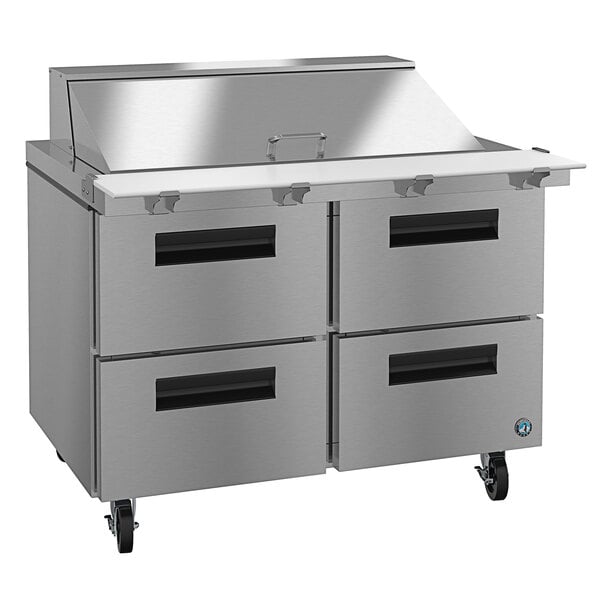 A stainless steel four drawer refrigerated sandwich prep table.