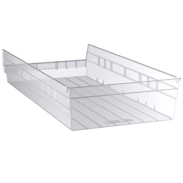 A clear plastic Regency shelf bin.