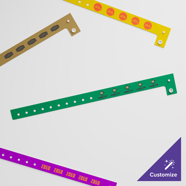 A group of yellow Carnival King plastic wristbands with red text and circles.