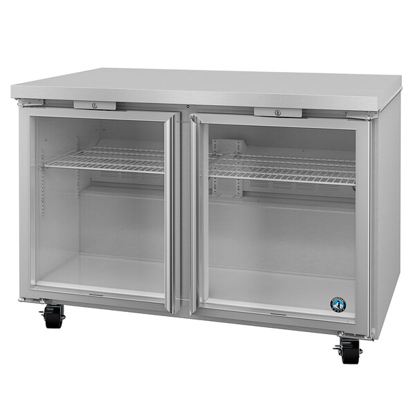 A silver Hoshizaki undercounter refrigerator with glass doors on wheels.