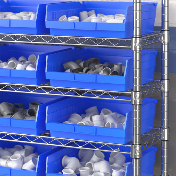 A white metal shelving unit with blue Regency shelf bins.