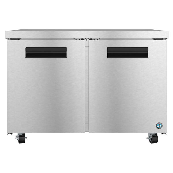 A stainless steel Hoshizaki undercounter freezer with black handles.